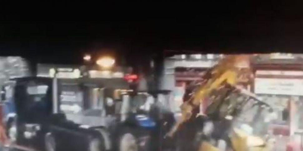 Digger Falls Off Truck After H...