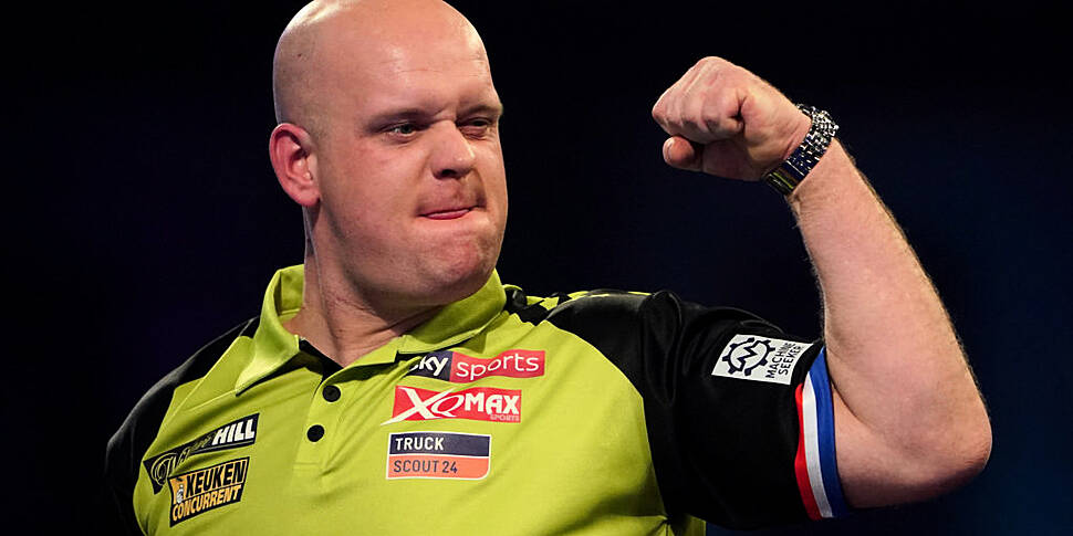 Michael van Gerwen advances to...