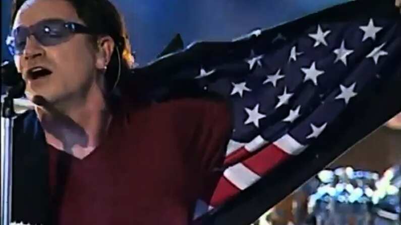 Bono of U2 playing the Super Bowl XXXVI halftime show