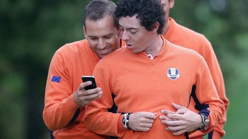 Sergio Garcia and Rory McIlroy share an intimate moment.