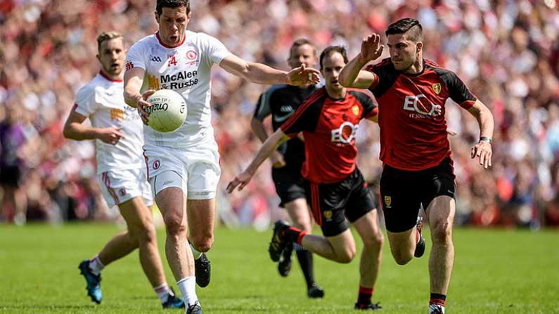 16 July 2017; Sean Cavanagh of Tyrone  in action against Niall McParland of Down during the Ulster GAA Football Senior Championship Final match between Tyrone and Down at St Tiernach's Park in Clones, Co. Monaghan. Photo by Oliver McVeigh/Sportsfile