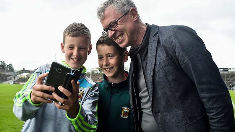 1 July 2017; RTE Pundit Joe Brolly with Mayo supporters Peter McHugh, age 12,  left, and his brother Tom, age 10, both from Hollymount Co. Mayo, before the start of the GAA Football All-Ireland Senior Championship Round 2A match between Mayo and Derry at Elverys MacHale Park, in Castlebar, Co Mayo. Photo by David Maher/Sportsfile