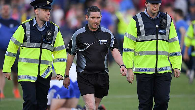 13 July 2017; Match referee Fergal Horgan is escorted off the pitch by Gardai after the Bord Gais Energy Munster GAA Hurling Under 21 Championship Semi-Final match between Waterford and Cork at Walsh Park in Waterford. Photo by Ray McManus/Sportsfile