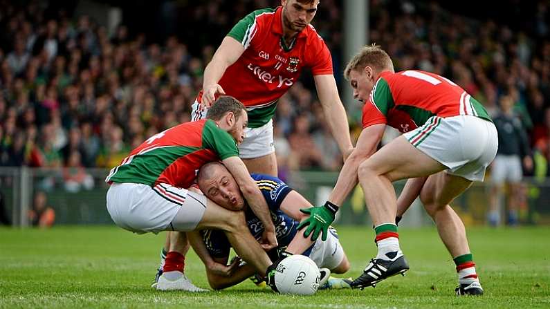 30 August 2014; Kieran Donaghy, Kerry, in action against Mayo players, left to right, Keith Higgins, Aidan O'Shea, and Kevin Keane. GAA Football All Ireland Senior Championship, Semi-Final Replay, Kerry v Mayo, Gaelic Grounds, Limerick. Picture credit: Daire Brennan / SPORTSFILE