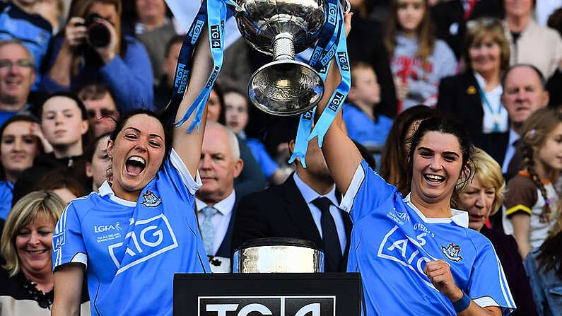 24 September 2017; Sinead Goldrick, left, and Niamh Collins of Dublin lift the Brendan Martin Cup after the TG4 Ladies Football All-Ireland Senior Championship Final match between Dublin and Mayo at Croke Park in Dublin. Photo by Brendan Moran/Sportsfile