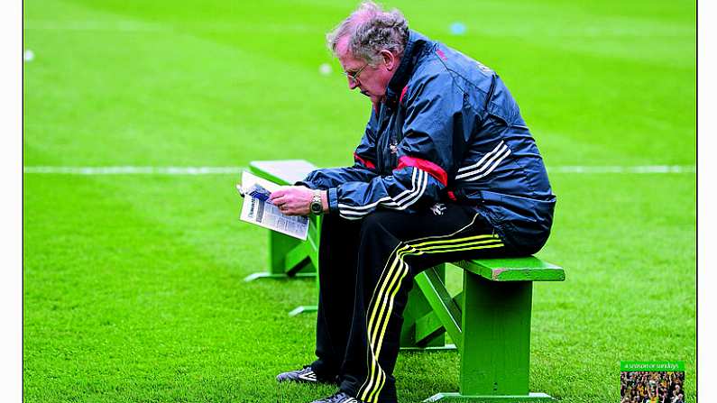 11 March 2012; Let's see how many of these I know now. Cork1s legendary team doctor Con Murphy tests the bench for size before his county's Croke Park league date with Dublin. Few know more players in the game than the highly regarded and congenial OEDoc. Picture credit: Ray McManus / SPORTSFILE from A Season of Sundays 2012  This image may be reproduced free of charge when used in conjunction with a review of the book \