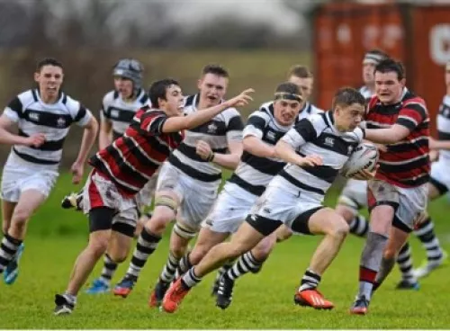 Ciaran Clifford, Belvedere College, is tackled by Jonathan Hopkins, Wesley College.