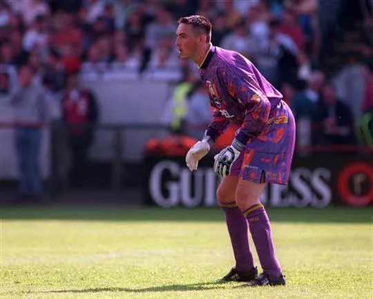 Dean Kiely rocking the iconc purple "acid trip" keeper jersey of the late 90's.