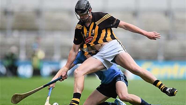 Kilkenny Hurler Being Chased By More Than One Aussie Rules Side