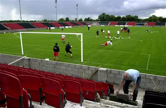 A Construction worker finishes the installation of seating at Flancare Park, Longford, after UEFA gave the go ahead for the match between Longford town and FC Liteks Lovech. Soccer. Picture credit; David Maher / SPORTSFILE *EDI*