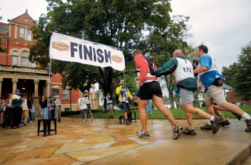 After spending three days competing in the heavily-wooded, moutainous West Virginia wilderness, teams were given a change of scenery for Wilderness Challenge's completion. The finish line was placed at the Fayetteville City Hall. Photo by PH1 Shane McCoy