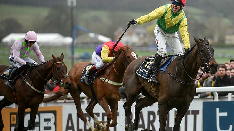 17 March 2017; Robbie Power celebrates on the way to winning the Timico Cheltenham Gold Cup Steeple Chase on Sizing John, ahead of Native River, with Richard Johnson, who finished second, and Djakadam, with Ruby Walsh up, who finished third, during the Cheltenham Racing Festival at Prestbury Park in Cheltenham, England. Photo by Cody Glenn/Sportsfile