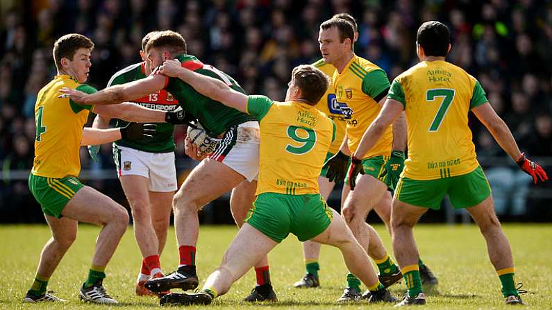 25 March 2018; Aidan O'Shea of Mayo in action against, from left, Eaoghan Ban Gallagher, Hugh McFadden and Neil McGee of Donegal during the Allianz Football League Division 1 Round 7 match between Donegal and Mayo at MacCumhaill Park in Ballybofey, Donegal. Photo by Oliver McVeigh/Sportsfile