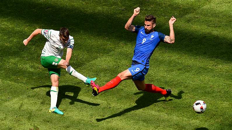 26 June 2016; Seamus Coleman of Republic of Ireland gets his shot off against Olivier Giroud of France during the UEFA Euro 2016 Round of 16 match between France and Republic of Ireland at Stade des Lumieres in Lyon, France. Photo by Paul Mohan/Sportsfile