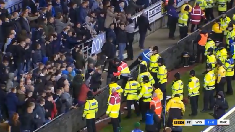 Watch: Manchester City Fans Hurl Bottles & Hoarding At Stewards