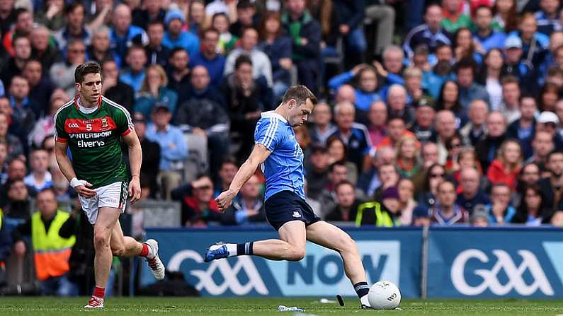 17 September 2017; Dean Rock of Dublin kicks his side's winning point, a free, as Lee Keegan of Mayo watches on during the GAA Football All-Ireland Senior Championship Final match between Dublin and Mayo at Croke Park in Dublin. Photo by Stephen McCarthy/Sportsfile