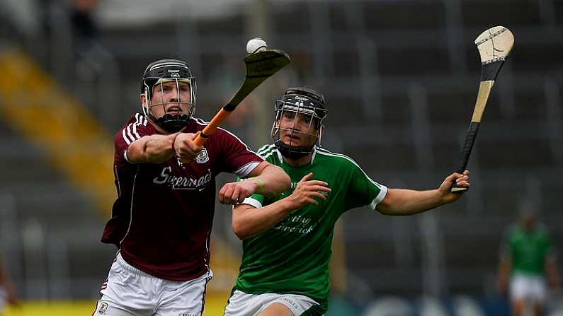 8 July 2018; Oisin Flannery of Galway in action against Padraig Harnett of Limerick during the Electric Ireland GAA Hurling All-Ireland Minor Championship Quarter-Final match between Galway and Limerick at Semple Stadium in Thurles, Co Tipperary. Photo by Ray McManus/Sportsfile