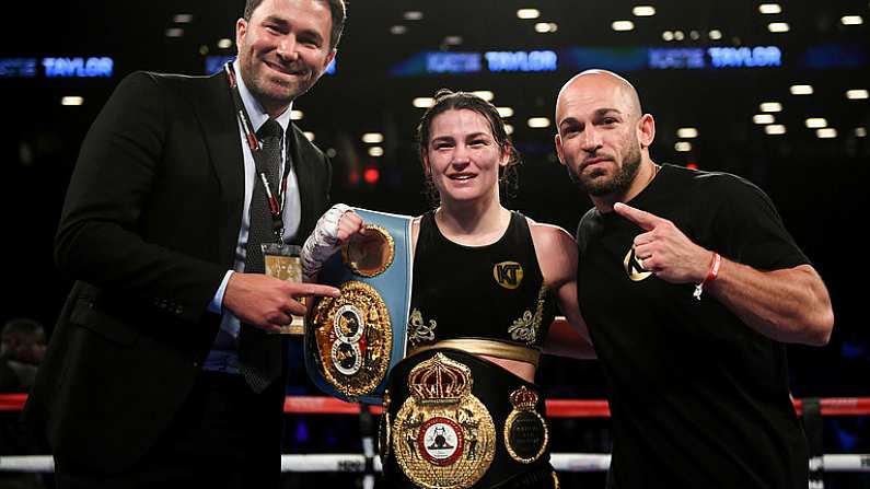 28 April 2018; Katie Taylor celebrates with promoter Eddie Hearn, left, and trainer Ross Enamait, right, following her WBA and IBF World Lightweight unification bout with Victoria Bustos at the Barclays Center in Brooklyn, New York. Photo by Stephen McCarthy/Sportsfile