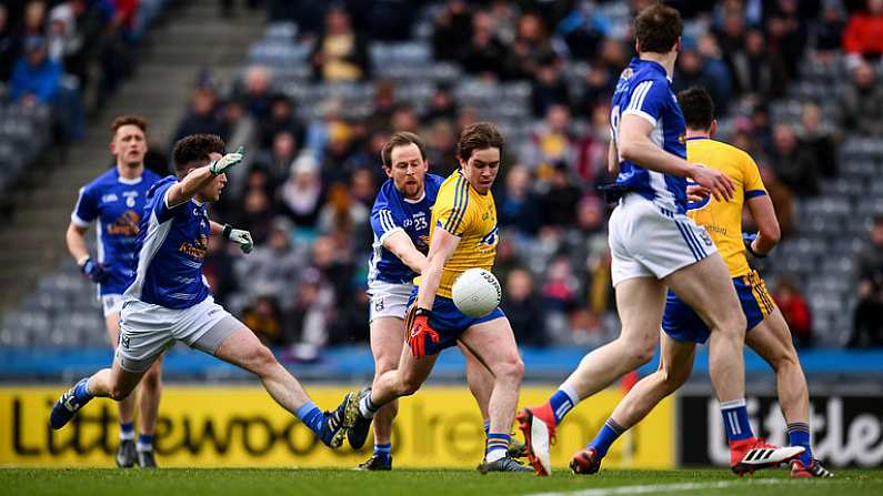 1 April 2018; David Murray of Roscommon shoots to score his side's second goal despite the tackle of Seanie Johnston of Cavan during the Allianz Football League Division 2 Final match between Cavan and Roscommon at Croke Park in Dublin. Photo by Stephen McCarthy/Sportsfile