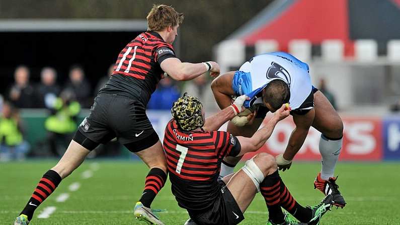 18 January 2014; Rodney Ah You, Connacht, is tackled by Charlie Hodgson and Kelly Brown, Saracens. Heineken Cup 2013/14, Pool 3, Round 6, Allianz Park, High Wycombe, England. Picture credit: Ray Ryan / SPORTSFILE