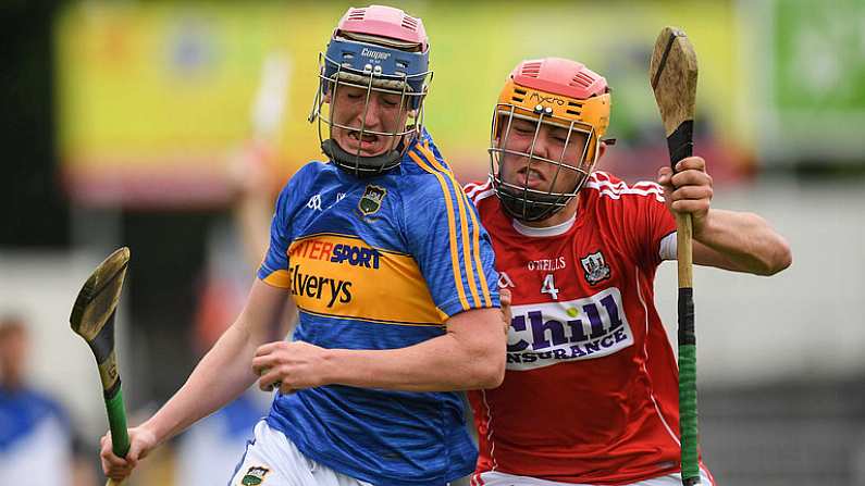 27 May 2018; Cian O'Farrell of Tipperary in action against Niall O'Riordan of Cork during the Munster GAA Hurling Minor Championship Round 2 match between Tipperary and Cork at Semple Stadium in Thurles, Tipperary. Photo by Eoin Noonan/Sportsfile