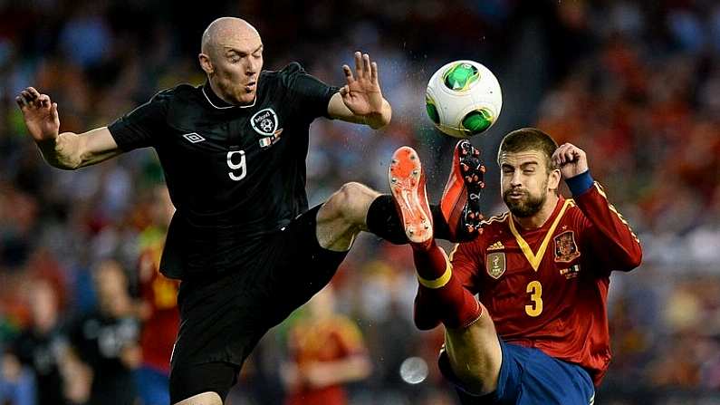 11 June 2013; Conor Sammon, Republic of Ireland, in action against Gerard Pique, Spain. International Friendly, Republic of Ireland v Spain, Yankee Stadium, Bronx, New York, USA. Picture credit: David Maher / SPORTSFILE