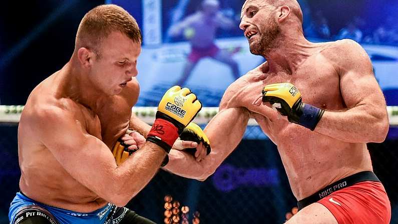 16 August 2014; Peter Queally, right, in action against Konrad Iwanowski during their welterweight bout. Cage Warriors 70 Fight Night, The Helix, Dublin. Picture credit: Ramsey Cardy / SPORTSFILE