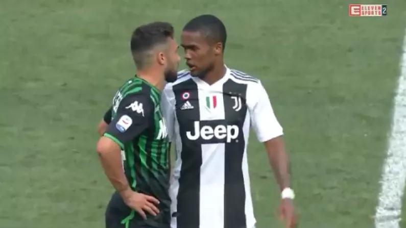 Watch: Juventus' Douglas Costa Caught Spitting Into Opponent's Mouth