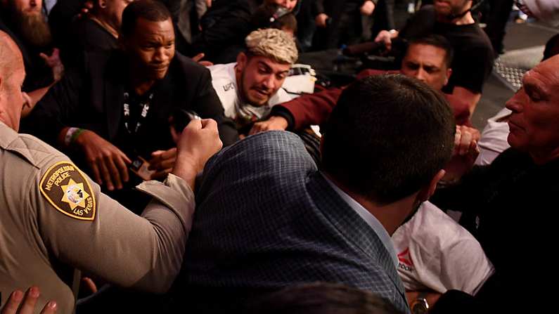 6 October 2018; Khabib Nurmagomedov leaves the octagon in an altercation with members of Conor McGregor's team, including Dillon Danis and John Kavanagh following defeat to  in their UFC lightweight championship fight during UFC 229 at T-Mobile Arena in Las Vegas, Nevada, USA. Photo by Stephen McCarthy/Sportsfile