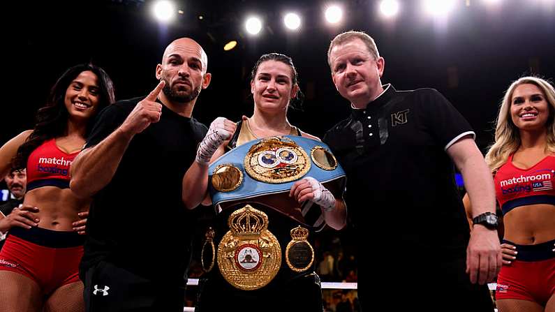 20 October 2018; Katie Taylor celebrates with trainer Ross Enamait, left, and manager Brian Peters following her WBA & IBF Female Lightweight World title bout against Cindy Serrano at TD Garden in Boston, Massachusetts, USA. Photo by Stephen McCarthy/Sportsfile