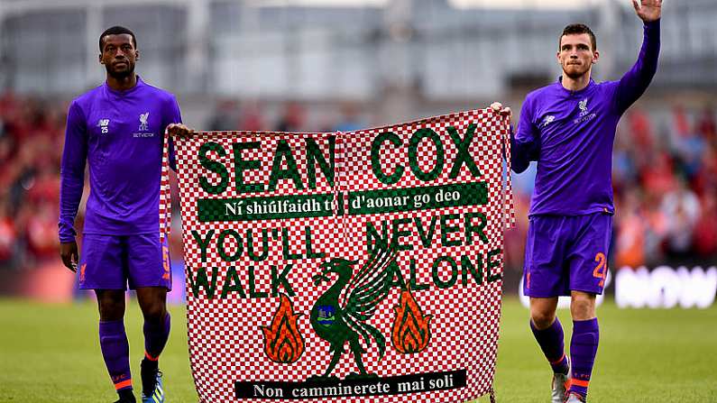 4 August 2018; Georginio Wijnaldum, left, and Andy Robertson of Liverpool hold a banner in support of Liverpool supporter Sean Cox following the Pre Season Friendly match between Liverpool and Napoli at the Aviva Stadium in Dublin. Photo by Seb Daly/Sportsfile