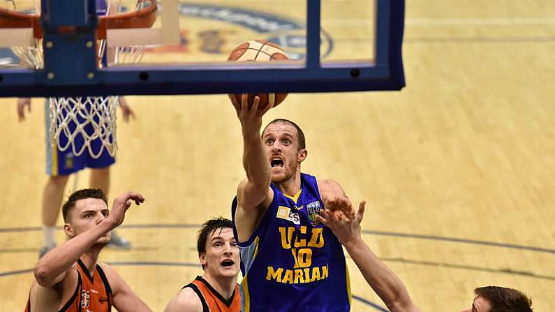 7 January 2017; Barry Drumm of UCD Marian goes for a layup ahead of Pyrobel Killester players, from left, Eoghain Kiernan, Ciaran Roe and Niall Hegarty during the Hula Hoops Men's National Cup semi-final match between Pyrobel Killester and UCD Marian at the Neptune Stadium in Cork. Photo by Brendan Moran/Sportsfile