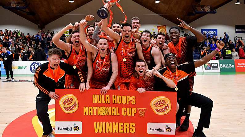 26 January 2019; The Pyrobel Killester team celebrate with the cup after the Hula Hoops Mens Pat Duffy National Cup Final match between Pyrobel Killester and UCD Marian at the National Basketball Arena in Tallaght, Dublin. Photo by Brendan Moran/Sportsfile