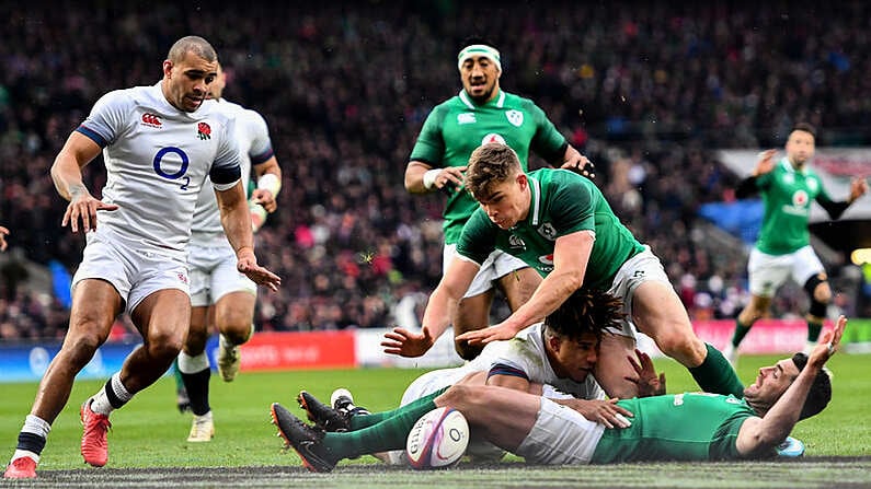 17 March 2018; Garry Ringrose of Ireland dives over to score his side's first try despite the tackle of Anthony Watson of England during the NatWest Six Nations Rugby Championship match between England and Ireland at Twickenham Stadium in London, England. Photo by Ramsey Cardy/Sportsfile