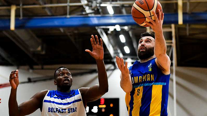 12 January 2019; Conor Meany of UCD Marian in action against Mike Thiep of Belfast Star during the Hula Hoops Men's Pat Duffy National Cup semi-final match between UCD Marian and Belfast Star at the Mardyke Arena UCC in Cork.  Photo by Brendan Moran/Sportsfile