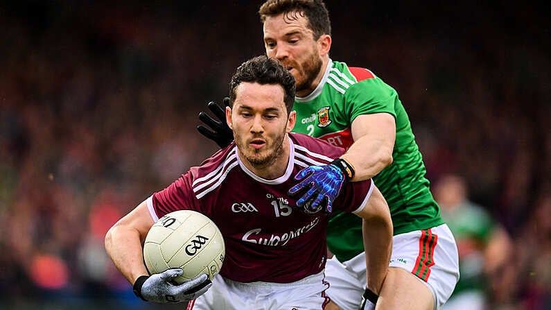 6 July 2019; Ian Burke of Galway is tackled by Chris Barrett of Mayo during the GAA Football All-Ireland Senior Championship Round 4 match between Galway and Mayo at the LIT Gaelic Grounds in Limerick. Photo by Brendan Moran/Sportsfile