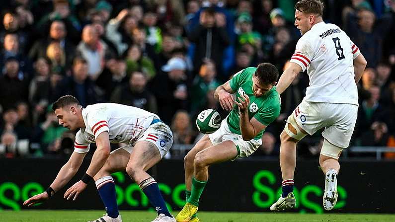 18 March 2023; Hugo Keenan of Ireland goes down after a tackle by Freddie Steward of England, resulting in a red card for Freddie Steward, during the Guinness Six Nations Rugby Championship match between Ireland and England at the Aviva Stadium in Dublin. Photo by Seb Daly/Sportsfile