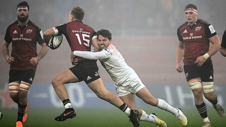 11 December 2022; Mike Haley of Munster is tackled by Antoine Dupont of Toulouse during the Heineken Champions Cup Pool B Round 1 match between Munster and Toulouse at Thomond Park in Limerick. Photo by Harry Murphy/Sportsfile