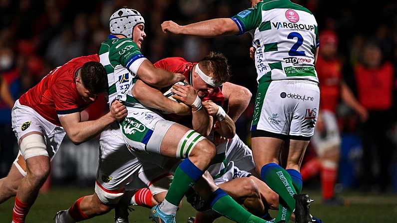 25 March 2022; Gavin Coombes of Munster is tackled by Manuel Zuliani of Benetton, left, during the United Rugby Championship match between Munster and Benetton at Musgrave Park in Cork. Photo by Piaras O Midheach/Sportsfile