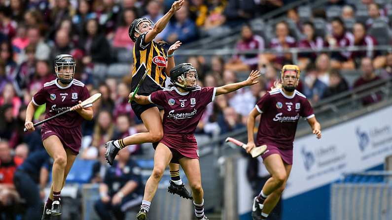 8 September 2019; Anna Farrell of Kilkenny passes off under pressure from Galway players, from left, Lorraine Ryan, Aoife Donohue and Sarah Dervan during the Liberty Insurance All-Ireland Senior Camogie Championship Final match between Galway and Kilkenny at Croke Park in Dublin. Photo by Piaras O Midheach/Sportsfile