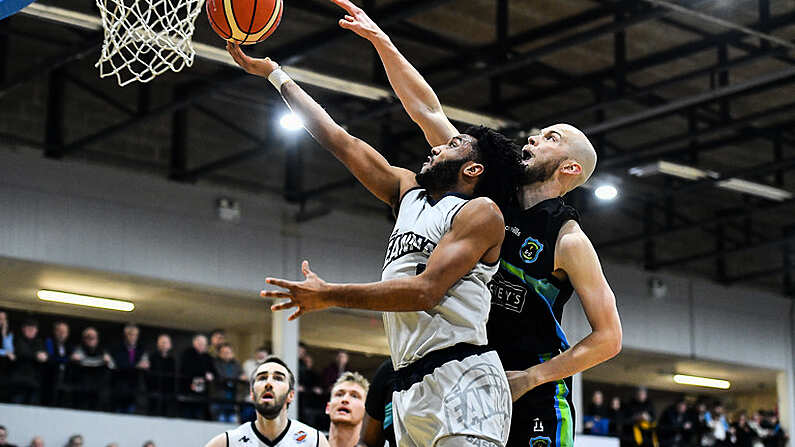 4 January 2020; Joshua Wilson of DBS Eanna goes for a layup ahead of Paul Dick of Garvey's Warriors Tralee during the Basketball Ireland Men's Superleague match between Garveys Warriors Tralee and DBS Eanna at Tralee Sports Complex in Tralee, Kerry. Photo by Brendan Moran/Sportsfile