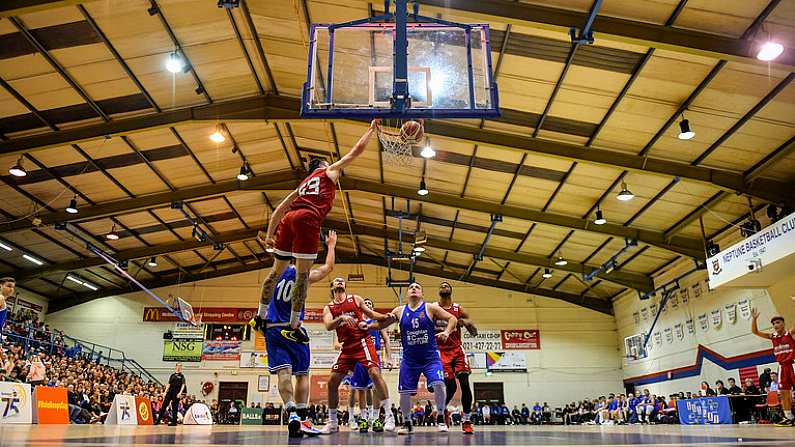 11 January 2020; Lorcan Murphy of Griffith College Templeogue dunks the ball over Roy Downey of Coughlan C&S Neptune during the Hula Hoops Men's Pat Duffy National Cup Semi-Final match between Griffith College Templeogue and Coughlan C&S Neptune at Neptune Stadium in Cork. Photo by Brendan Moran/Sportsfile