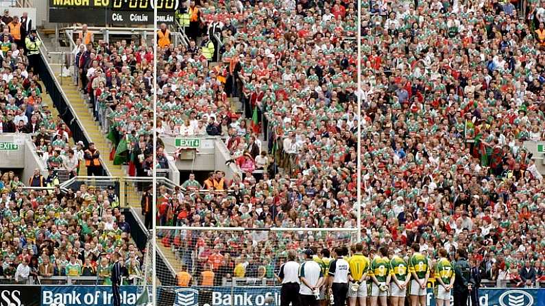 26 September 2004; The Kerry team stand together in front of the new Hill 16 during the national anthem before the game. Bank of Ireland All-Ireland Senior Football Championship Final, Kerry v Mayo, Croke Park, Dublin. Picture credit; Brendan Moran / SPORTSFILE *** Local Caption *** Any photograph taken by SPORTSFILE during, or in connection with, the 2004 Bank of Ireland All-Ireland Senior Football Final which displays GAA logos or contains an image or part of an image of any GAA intellectual property, or, which contains images of a GAA player/players in their playing uniforms, may only be used for editorial and non-advertising purposes.  Use of photographs for advertising, as posters or for purchase separately is strictly prohibited unless prior written approval has been obtained from the Gaelic Athletic Association.