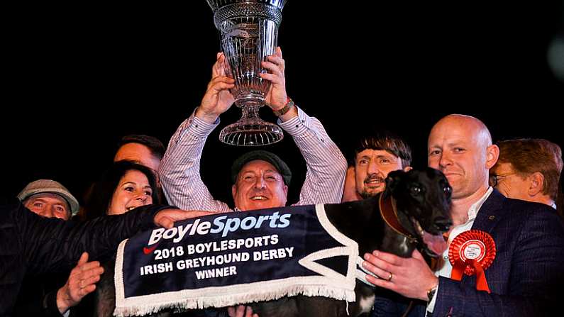 22 September 2018; The winning connections of Ballyanne Sim including trainer James Robinson, right, and owner Eamon Cleary lifting the cup after winning the 2018 Irish Greyhound Derby at Shelbourne Park in Dublin. Photo by Harry Murphy/Sportsfile