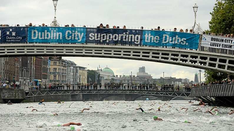 19 September 2015; Participants swim under the Ha'Penny Bridge during the Dublin City Liffey Swim. Dublin City Liffey Swim. Dublin. Picture credit: Cody Glenn / SPORTSFILE