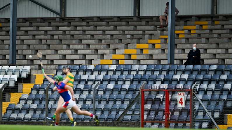 1 August 2020; A spectator wearing a face mask watches the Cork County Senior Hurling Championship Group B Round 1 match between Blackrock and Erin's Own at Pairc Ui Rinn  in Cork. GAA matches continue to take place in front of a limited number of people due to the ongoing Coronavirus restrictions. Photo by Brendan Moran/Sportsfile