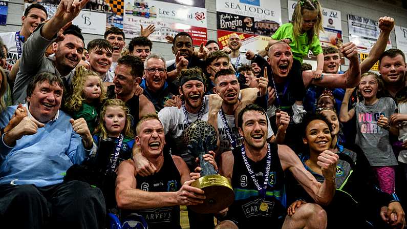 24 March 2019; Garvey's Tralee Warriors players celebrate with the Superleague trophy after the Basketball Ireland Men's Superleague match between Garvey's Warriors Tralee and UCD Marian in the Tralee Sports Complex in Tralee, Co. Kerry. Photo by Diarmuid Greene/Sportsfile