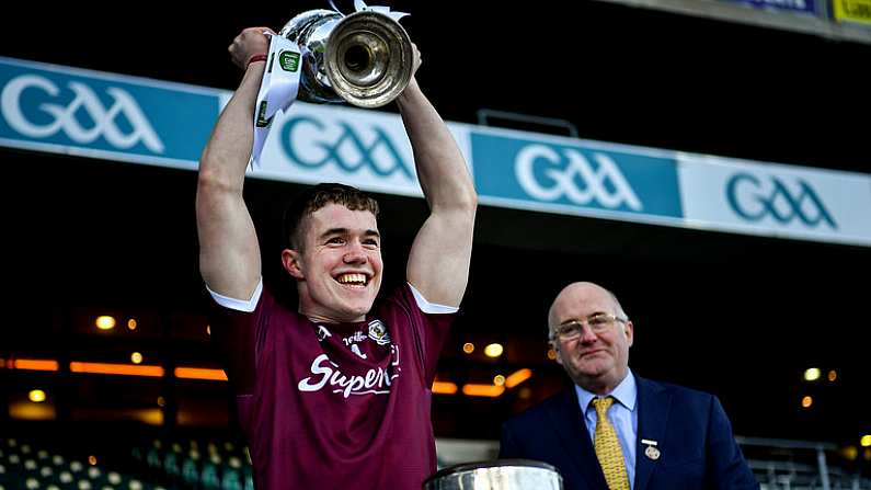 19 December 2020; Galway captain Jack Glynn accepts the cup from Uachtaran Chumann Luthchleas Gael John Horan following victory in the EirGrid GAA Football All-Ireland Under 20 Championship Final match between Dublin and Galway at Croke Park in Dublin. Photo by Ray McManus/Sportsfile