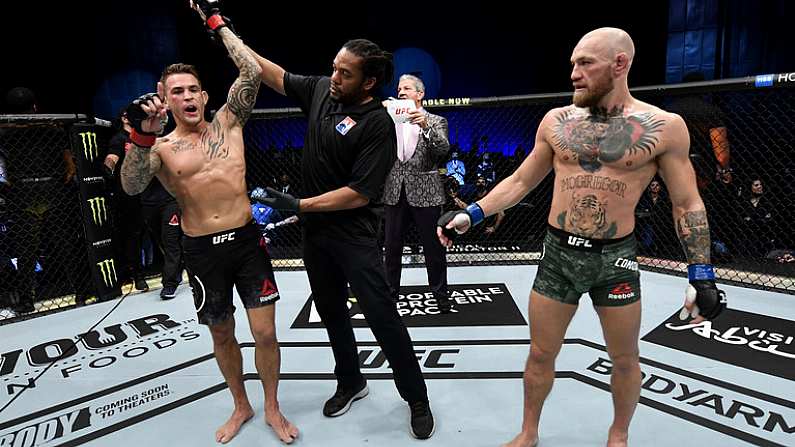 24 January 2021; Dustin Poirier, left, has his hand raised by referee Herb Dean after defeating Conor McGregor in the second round of their UFC 257 Lightweight bout at the Etihad Arena in Abu Dhabi, United Arab Emirates. Photo by Jeff Bottari/Zuffa LLC/Getty Images via Sportsfile