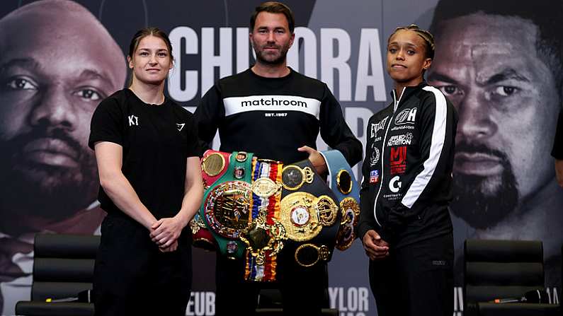 29 April 2021; Katie Taylor and Natasha Jonas square off, in the company of promoter Eddie Hearn, during a press conference at the Matchroom Boxing fight hotel in Manchester, England, ahead of their WBC, WBA, IBF and WBO female lightweight title fight on Saturday Night. Photo by Mark Robinson / Matchroom Boxing via Sportsfile